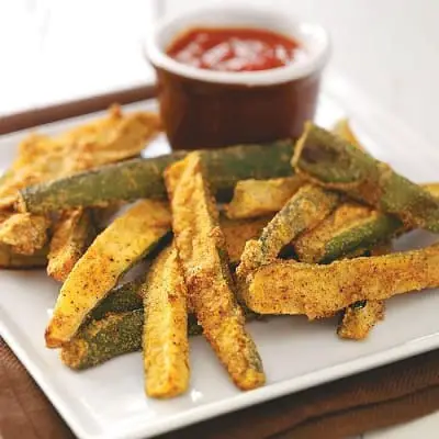 zucchini fries and sauce on a plate