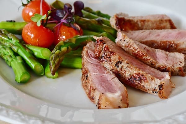 cooked meat and vegetables in a plate