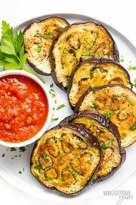 Roasted egg plant with salsa in bowl