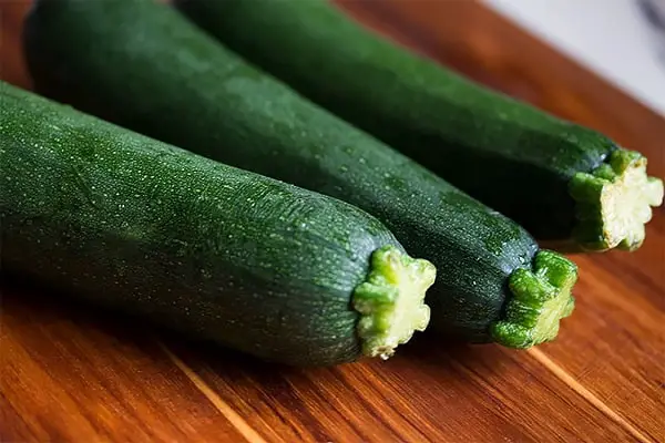 3 zucchinis on a cutting board