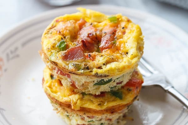 Two stacked low carb egg muffin cups on a plate