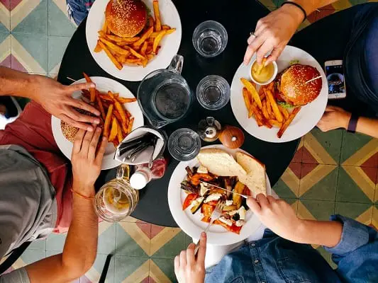 Group of people eating fatty foods