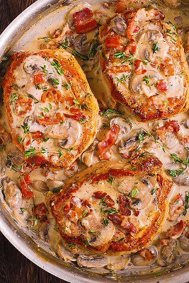 Bacon and mushroom pork chops in a serving dish