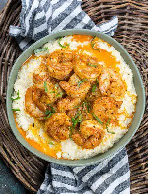 Keto shrimp and grits on rice on a plate