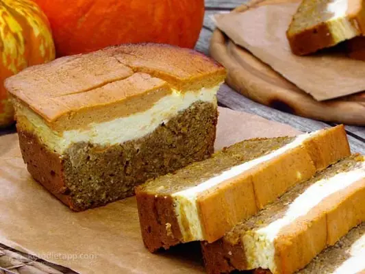 Keto Halloween pumpkin and orange cheese bread on a cutting board