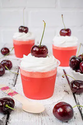 Cherry parfaits in cups with cherries on top