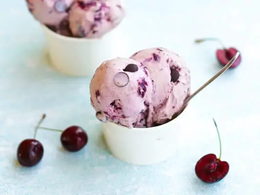 Keto Cherry garcia ice cream in cups with loose cherries