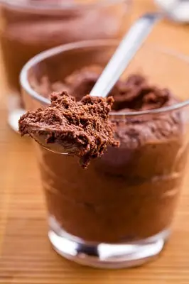 Close up photograph of a glass of keto ricotta chocolate mousse