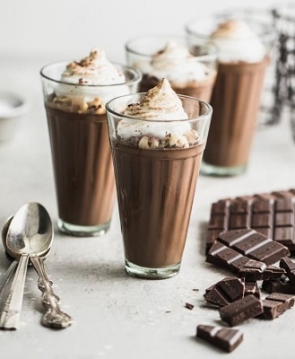 Keto chocolate mousse with toasted meringue in milkshake glass