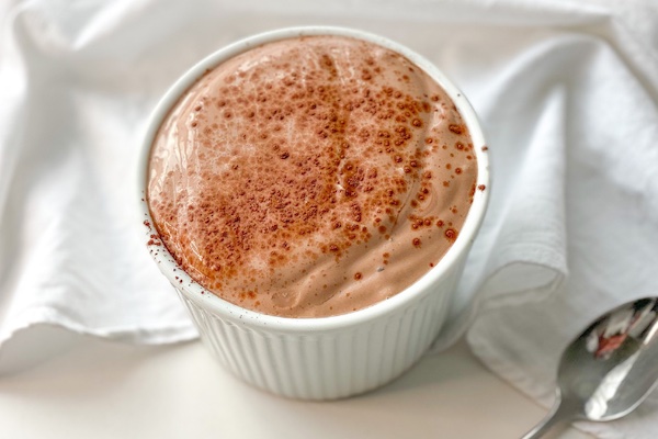 keto chocolate cottage cheese mousse in a white bowl