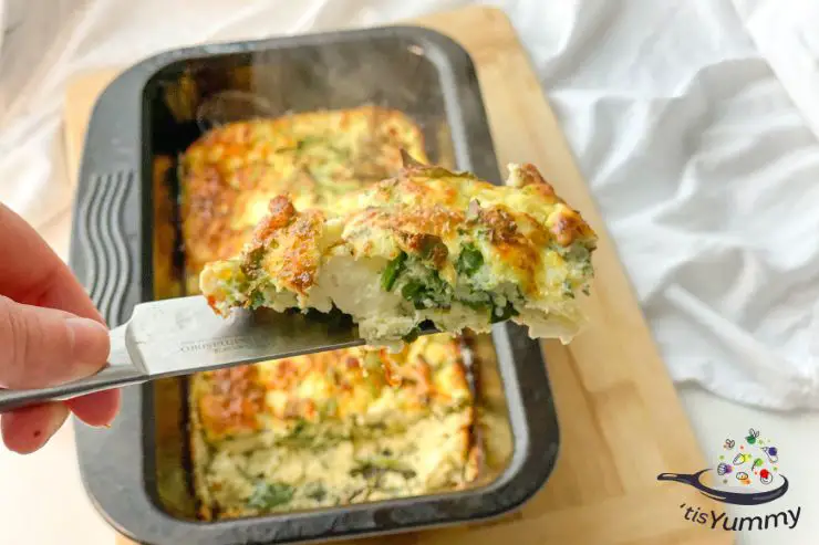 keto cottage cheese spanakopita being served on a kitchen knife
