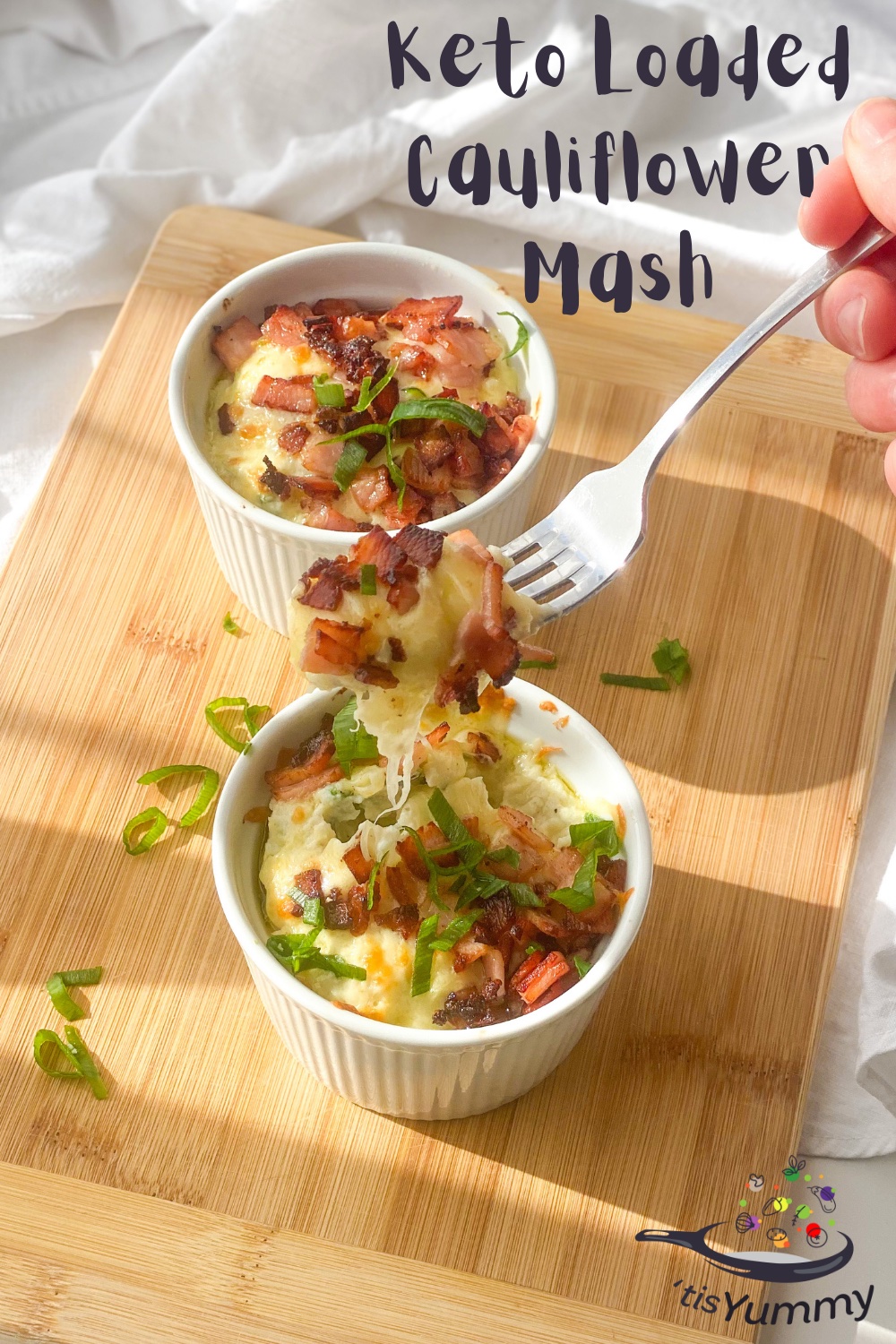 lazy keto cauliflower mash in two bowls about to be eaten with fork