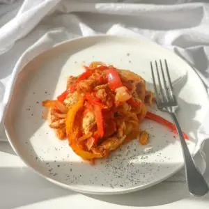 lazy keto chicken tenders and peppers on a white plate