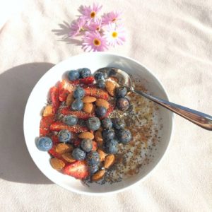 keto cottaeg cheese breakfast bowl with a silver spoon in it