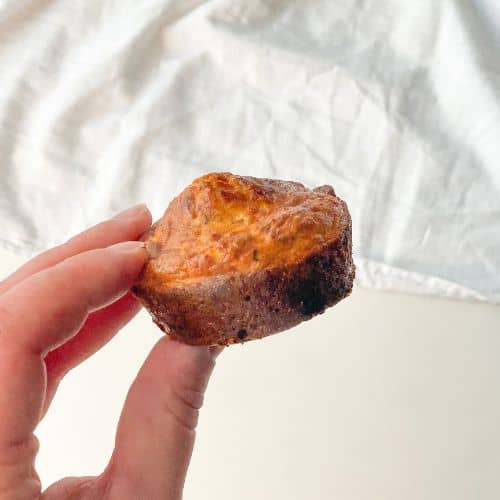 hand holding a keto cottage cheese breakfast muffin