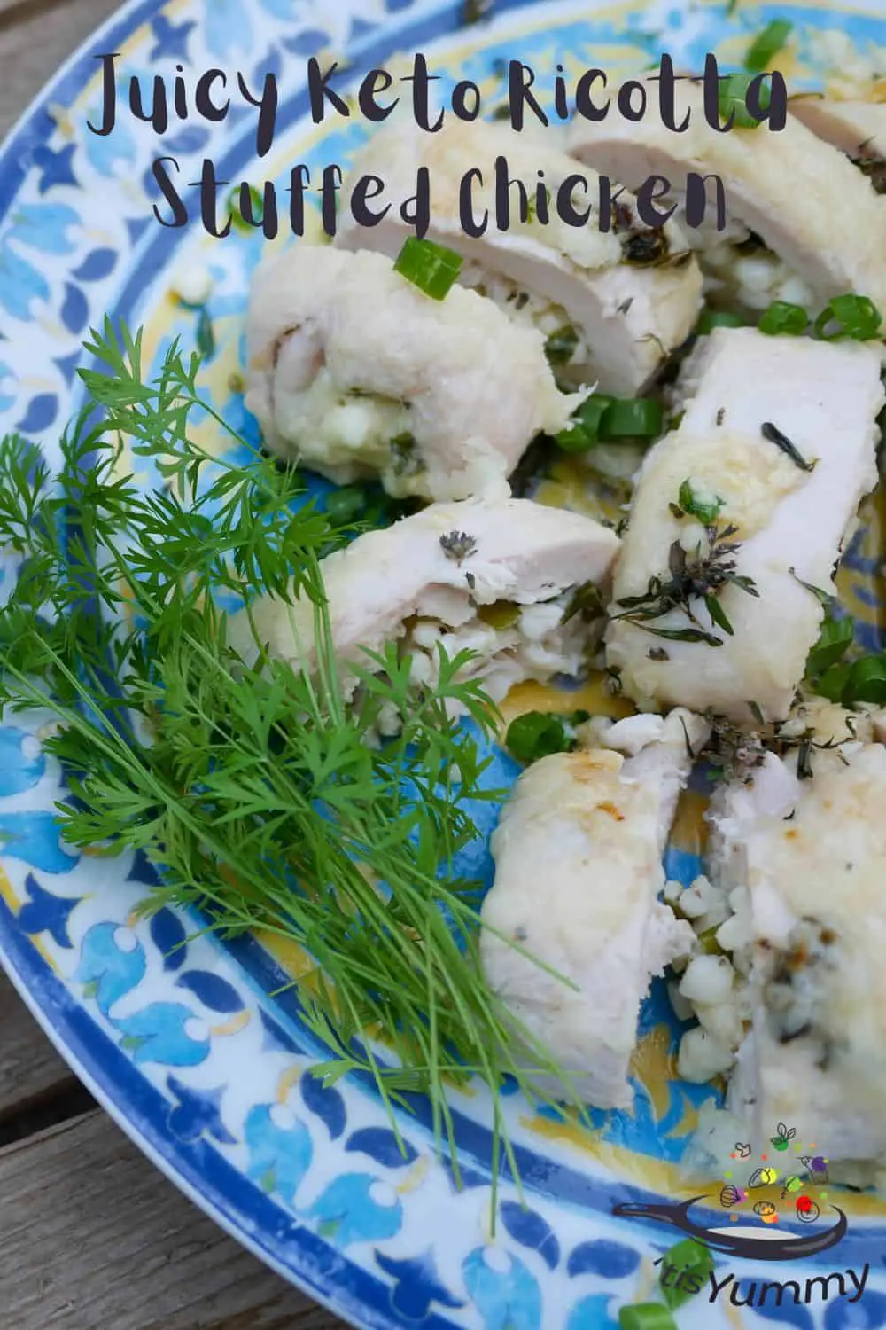 keto ricotta stuffed chicken on a blue plate with garnish