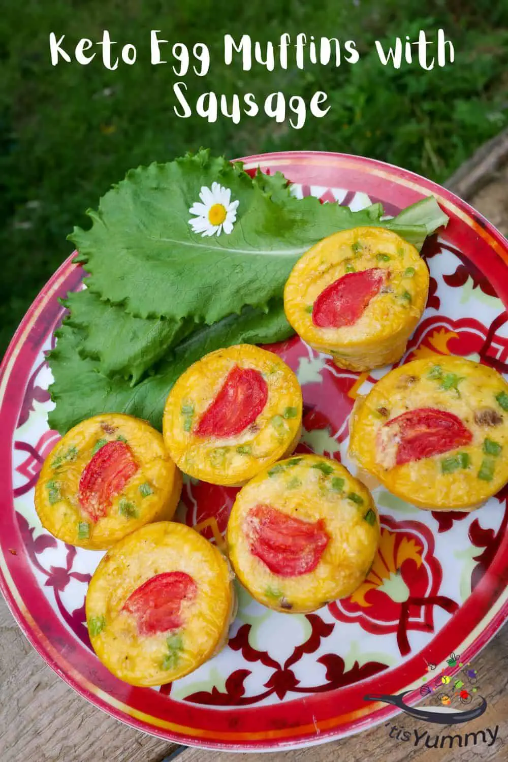 keto egg muffins with sausage on a plate with green lettuce leaf
