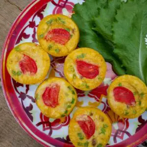 keto egg muffins on a plate with garnish