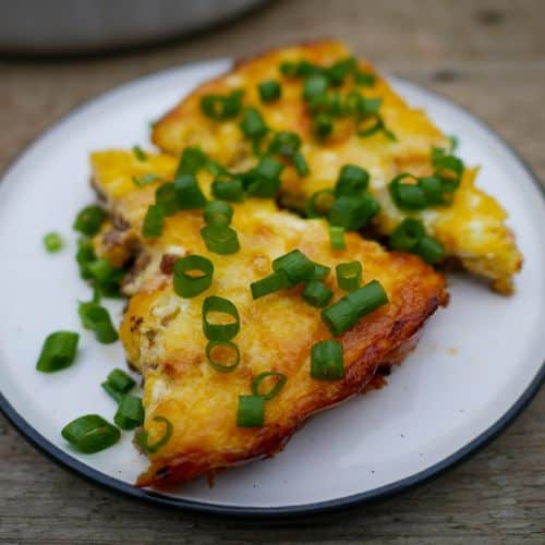 keto lasagna on a plate with green onion as garnish