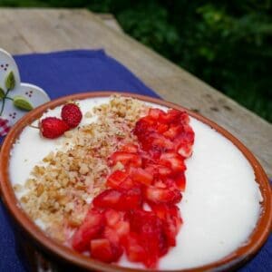 no-bake keto ricotta pecan cheesecake on a dish with decorations