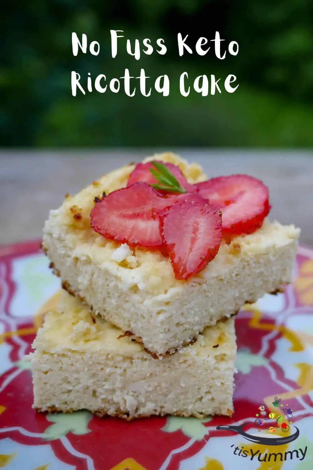 keto ricotta cake on a plate with strawberries on top