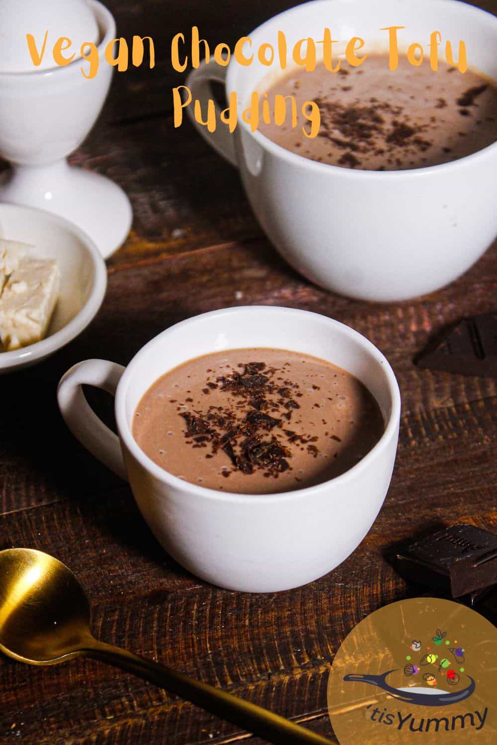 vegan chocolate tofu pudding in a mug with a golden spoon
